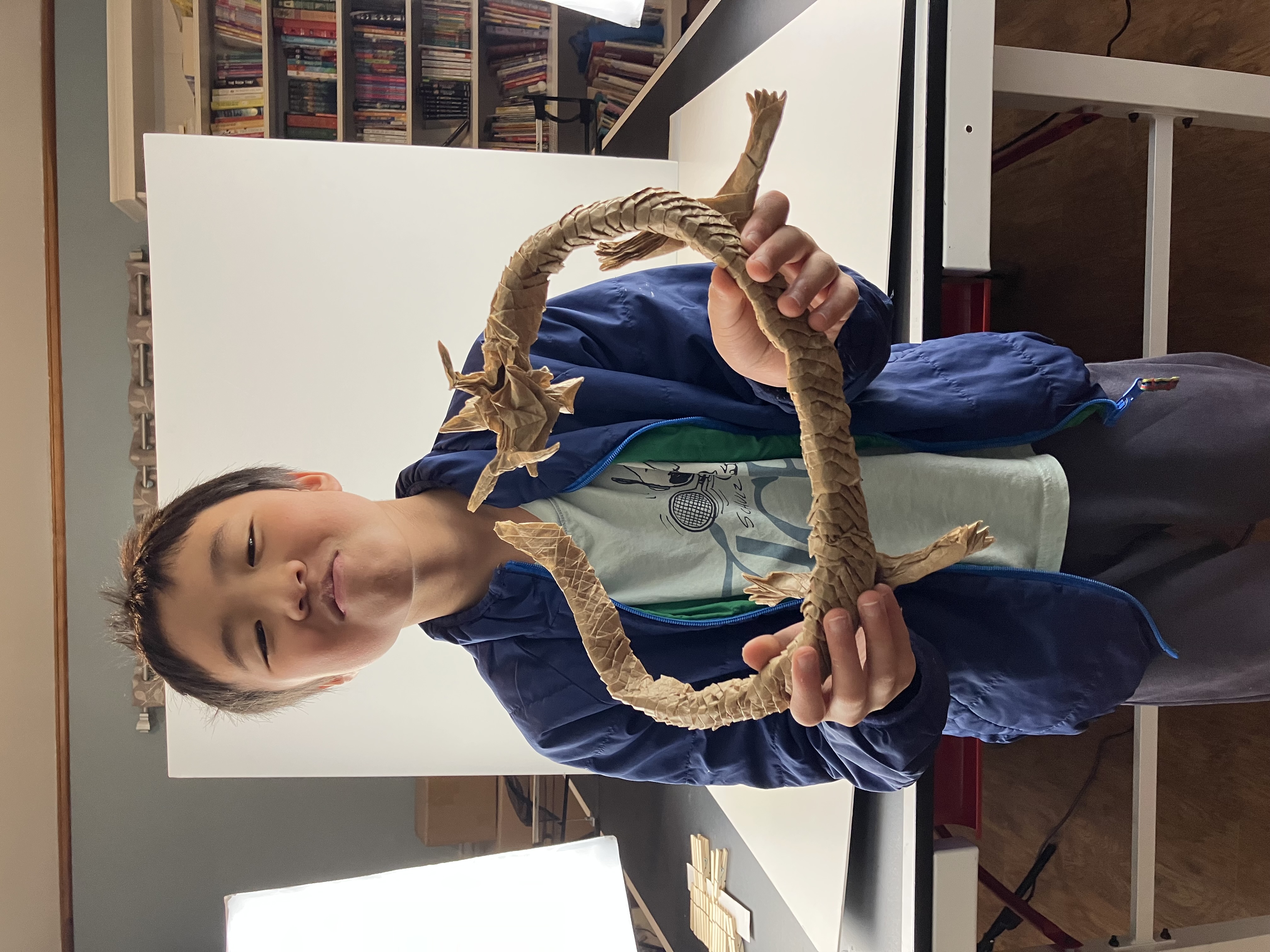 Artist holding the serpent dragon